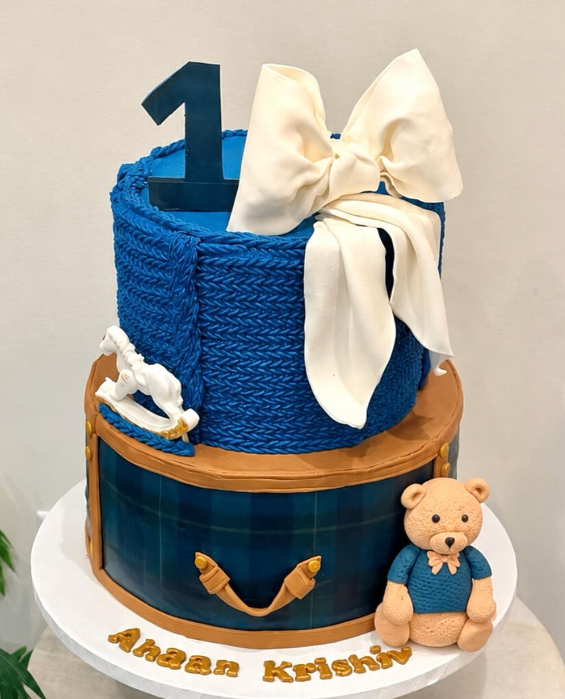 First Birthday Special Blue and white first birthday cake with a teddy bear and large number one decoration